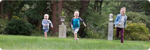 Children running through yard