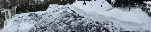 a roof covered with snow and ice